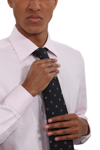 Businessman straightening his tie - Foto, Imagen