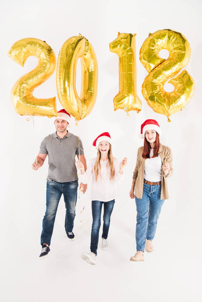 family with balloons for new year - Foto, Imagen