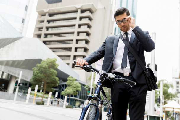 Young businessmen with a bike - Photo, image