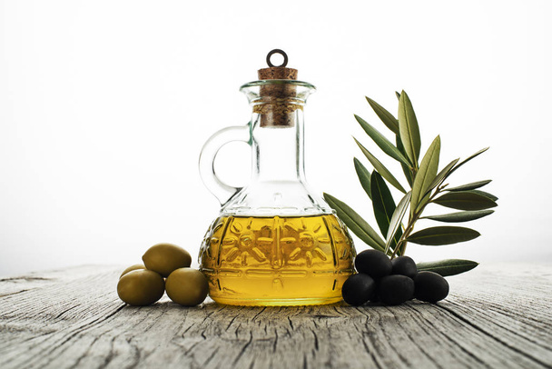 Olive oil with branch - Photo, Image