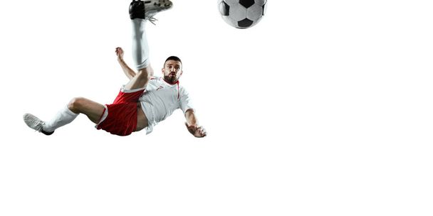 Voetballer op een witte achtergrond - Foto, afbeelding