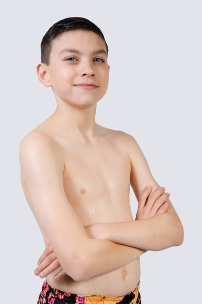 Young teenage caucasian boy wearing swimwear - Fotó, kép