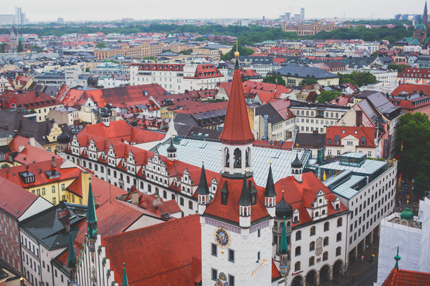 Beautiful super wide-angle sunny aerial view of Munich, Bayern, Bavaria, Germany with skyline and scenery beyond the city, seen from the observation deck of St. Peter Church - 写真・画像