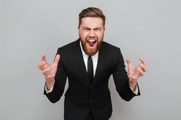 Portrait of an angry bearded man in suit shouting - Fotoğraf, Görsel