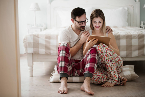 Attractive couple in love using digital tablet - Fotoğraf, Görsel