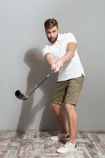 Full length image of a golfer playing in golf - Φωτογραφία, εικόνα