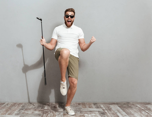 Full length image of a Happy Screaming golfer in sunglasses - Foto, Imagen