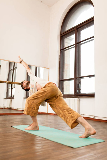 Man practicing yoga - Фото, изображение