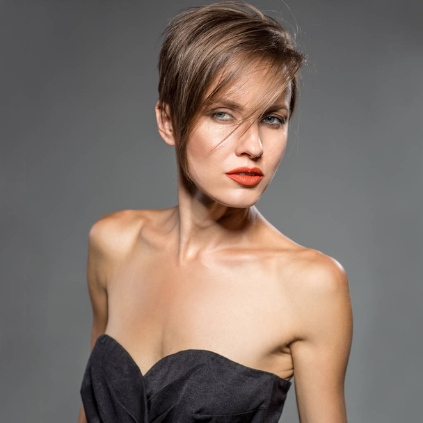 Portrait of beautiful girl with red lips short hair - Photo, Image