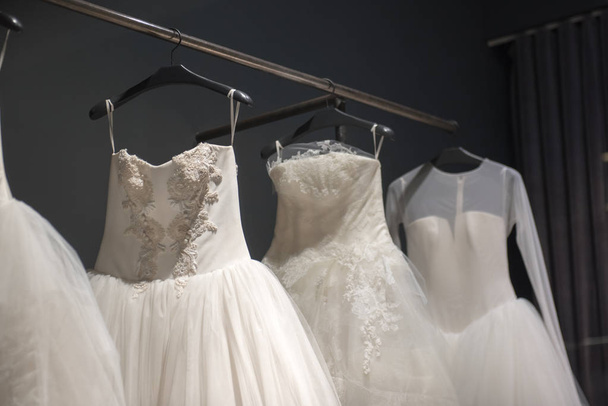 Selection of handmade white wedding gowns - 写真・画像