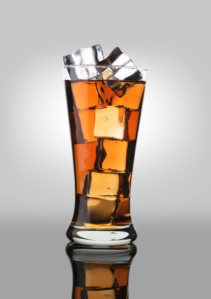 Cold Drink Cola Soda Soft Drink in a Glass with Ice Cubes - Foto, imagen