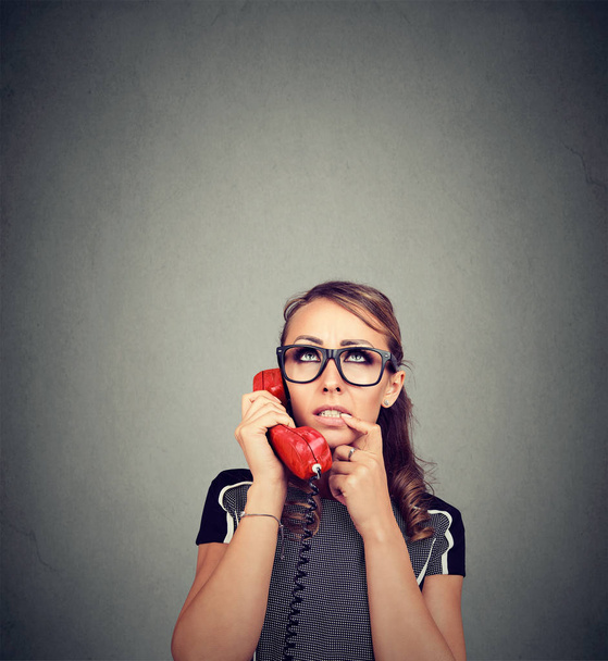 Worried perplexed young woman on the phone - Foto, imagen