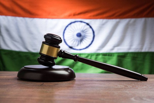 stock photo showing Indian low and jurisdiction - Indian national flag or tricolour with wooden gavel showing concept of law in India - Photo, Image