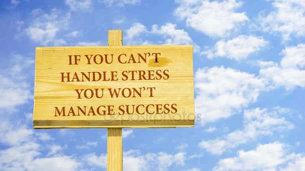 If you can't handle stress, you won't manage success. Words on a wooden sign against time lapse clouds in the blue sky. - Footage, Video