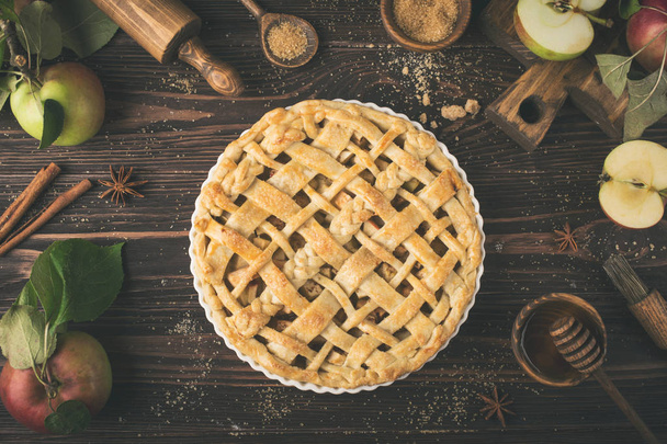 apple pie and ingredients on wooden background - Foto, Imagem