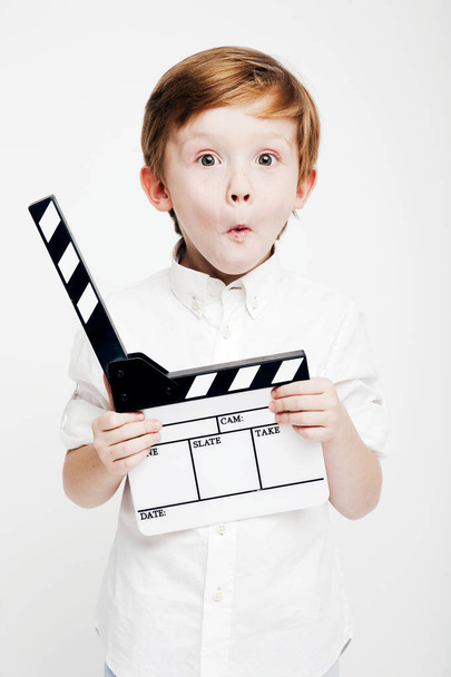 Little cute emotional boy with cinema clapper - Φωτογραφία, εικόνα