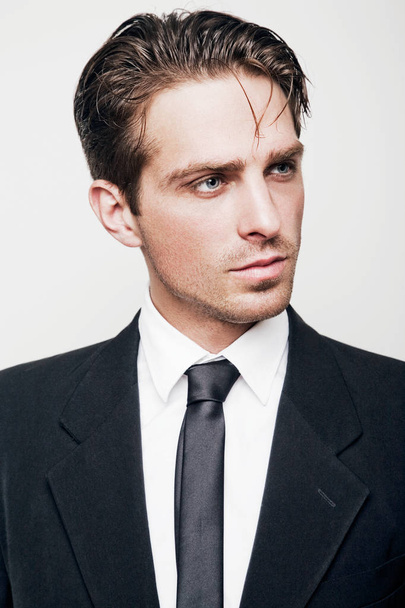 Portrait of a young attractive man in a classic suit - Foto, immagini