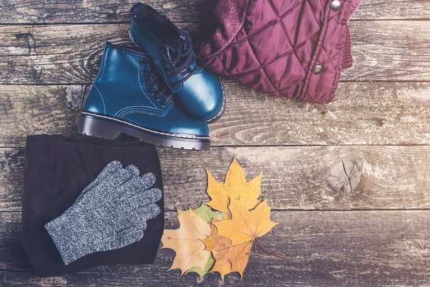 Boy's autumn fashion clothes and accessories on wooden background. Flat lay, copyspace. - Photo, Image
