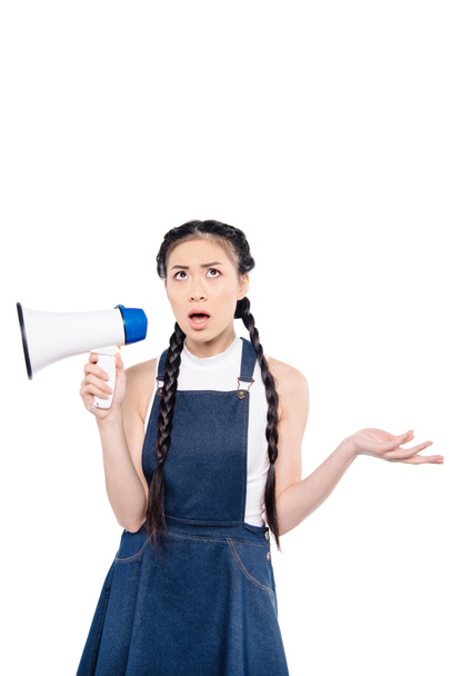 confused asian woman with loudspeaker  - Photo, image