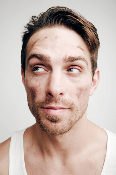 Emotions. Portrait of man with dirty face - 写真・画像
