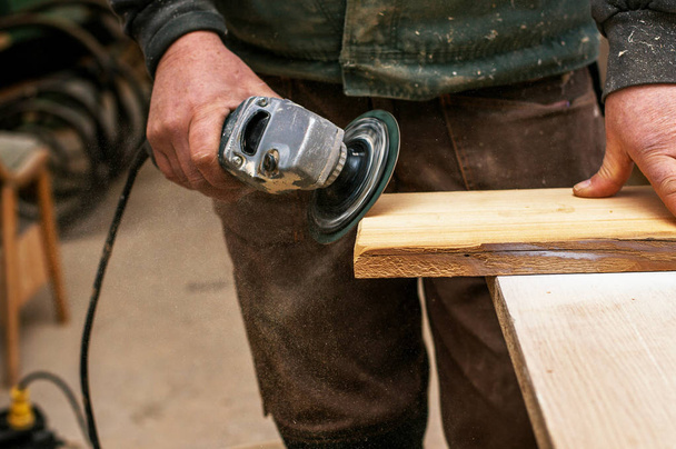 Carpenter working with wood  - Fotografie, Obrázek
