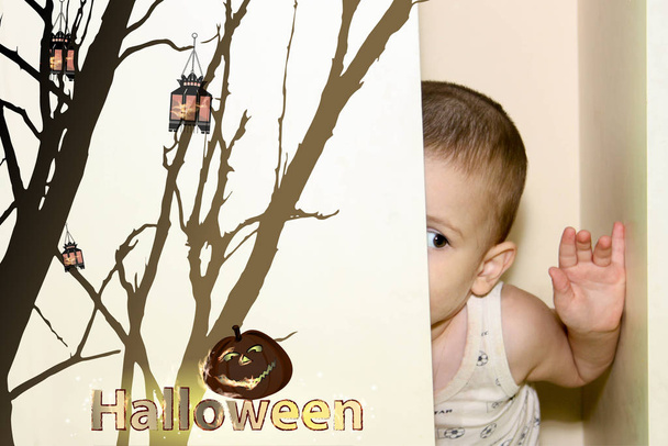 Halloween. the boy is hiding in the closet - Fotó, kép