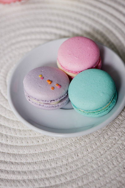 Macaroon pastel tones on a wooden background.Beautiful sweets - Photo, Image