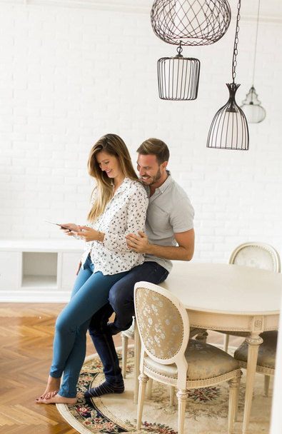 Couple using digital tablet together - Foto, imagen
