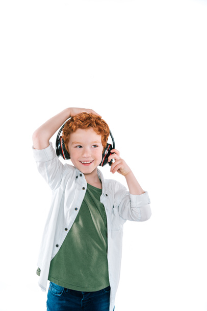 kid listening music with headphones - Фото, изображение