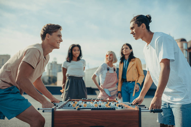 friends playing table football - Foto, Imagen