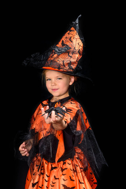little witch holding spider - Foto, Imagen