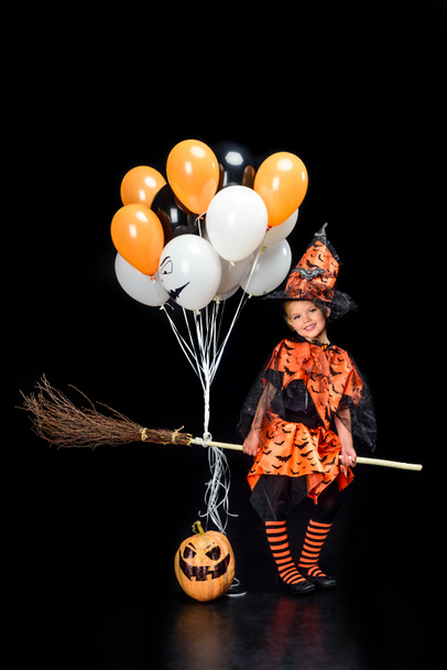 little witch with broom and balloons  - Fotoğraf, Görsel