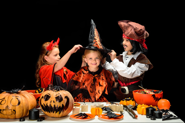 children in halloween costumes with sweets - Photo, Image