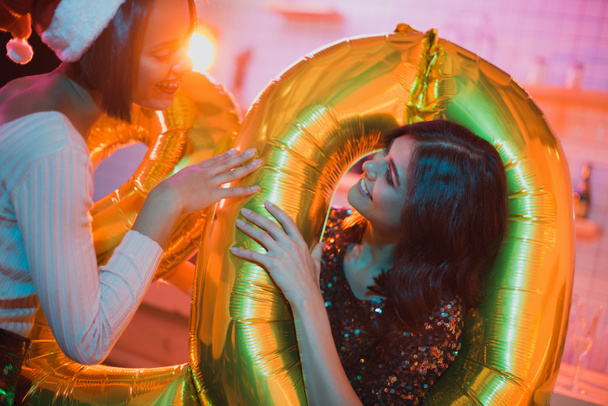 multicultural women with balloons - 写真・画像