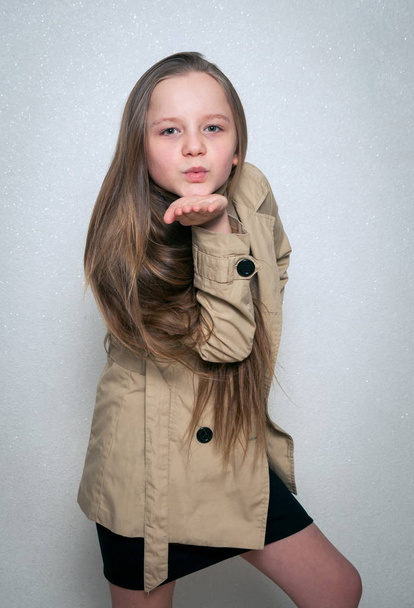 young girl in coat - Фото, изображение
