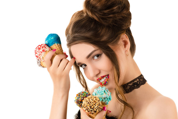 charming brunette with bright makeup on lips and with ice cream in hands - Photo, Image