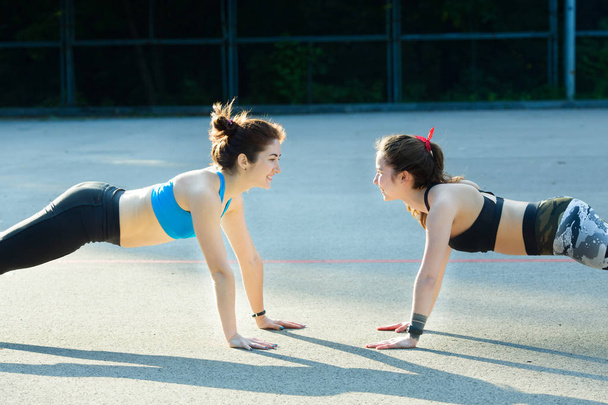 Two sports girls engaged in gymnastics - Fotografie, Obrázek