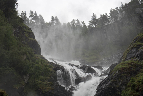 Waterfall in Norway rainy weather - Foto, immagini