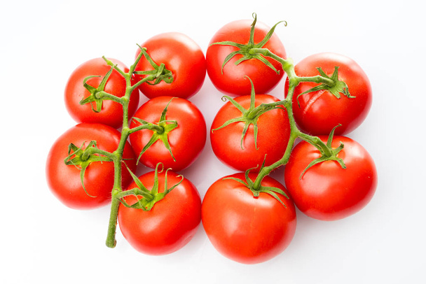tomato isolated on white background.  Bunch of fresh tomatoes - Zdjęcie, obraz