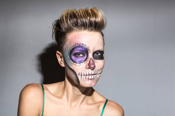 Beautiful woman with bright halloween makeup  - Foto, afbeelding