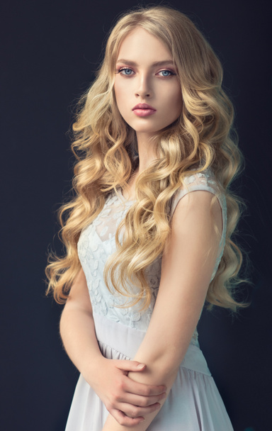 Blonde   girl with long  , curly hair  - Photo, Image