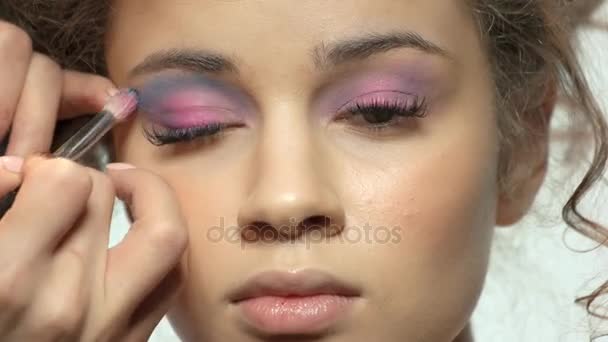 Visagist applying eyeshadow close up. - Footage, Video