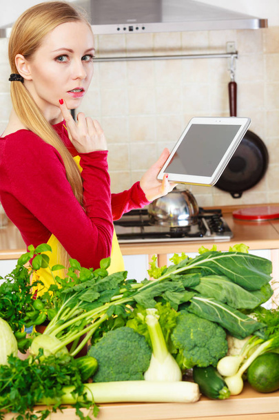Woman having green vegetables thinking about cooking - Fotoğraf, Görsel