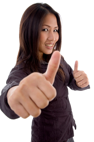 Pleased female with thumbs up - Foto, Bild