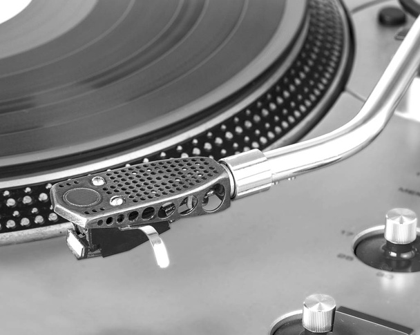 Old dusty vinyl turntable player isolated over white background. - Photo, Image