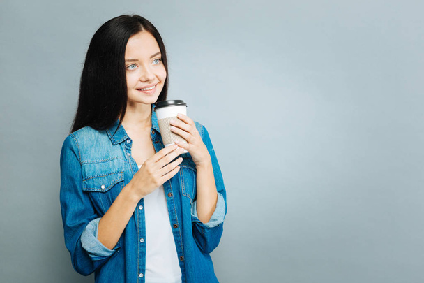 Relaxed girl drinking tasty coffee - Photo, image