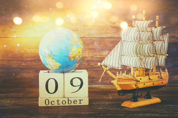 Columbus day concept with old ship over wooden background - Φωτογραφία, εικόνα