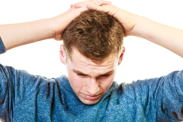 Closeup stressed man holds head with hands - Valokuva, kuva