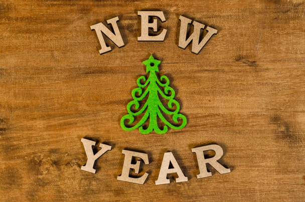 Green Christmas tree and sign New year from wooden letters - Fotoğraf, Görsel