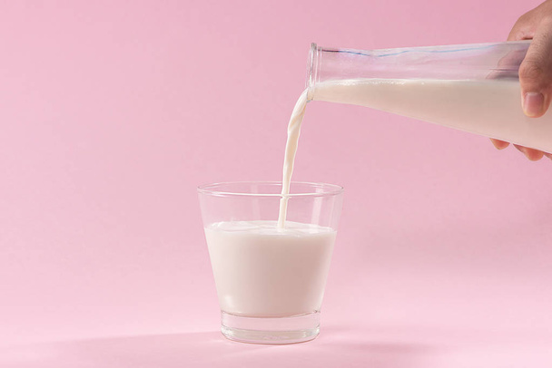 Pouring milk into glass - Photo, Image
